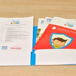 printed brochure and forms placed in a two pocket presentation folder
