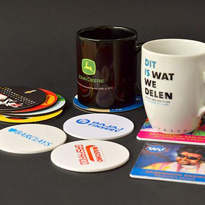 collection of printed mugs and coaster