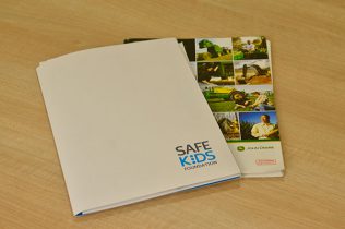 collection of printed presentation folders