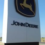 Large factory entrance metal and acrylic sign