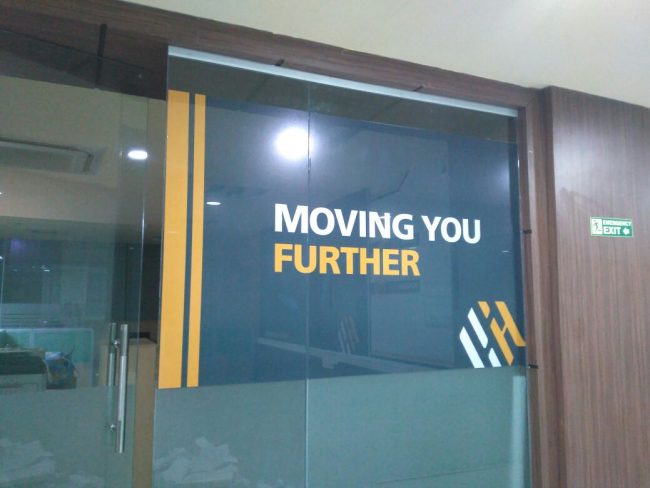 glass pasting of vinyl posters inside office in pune